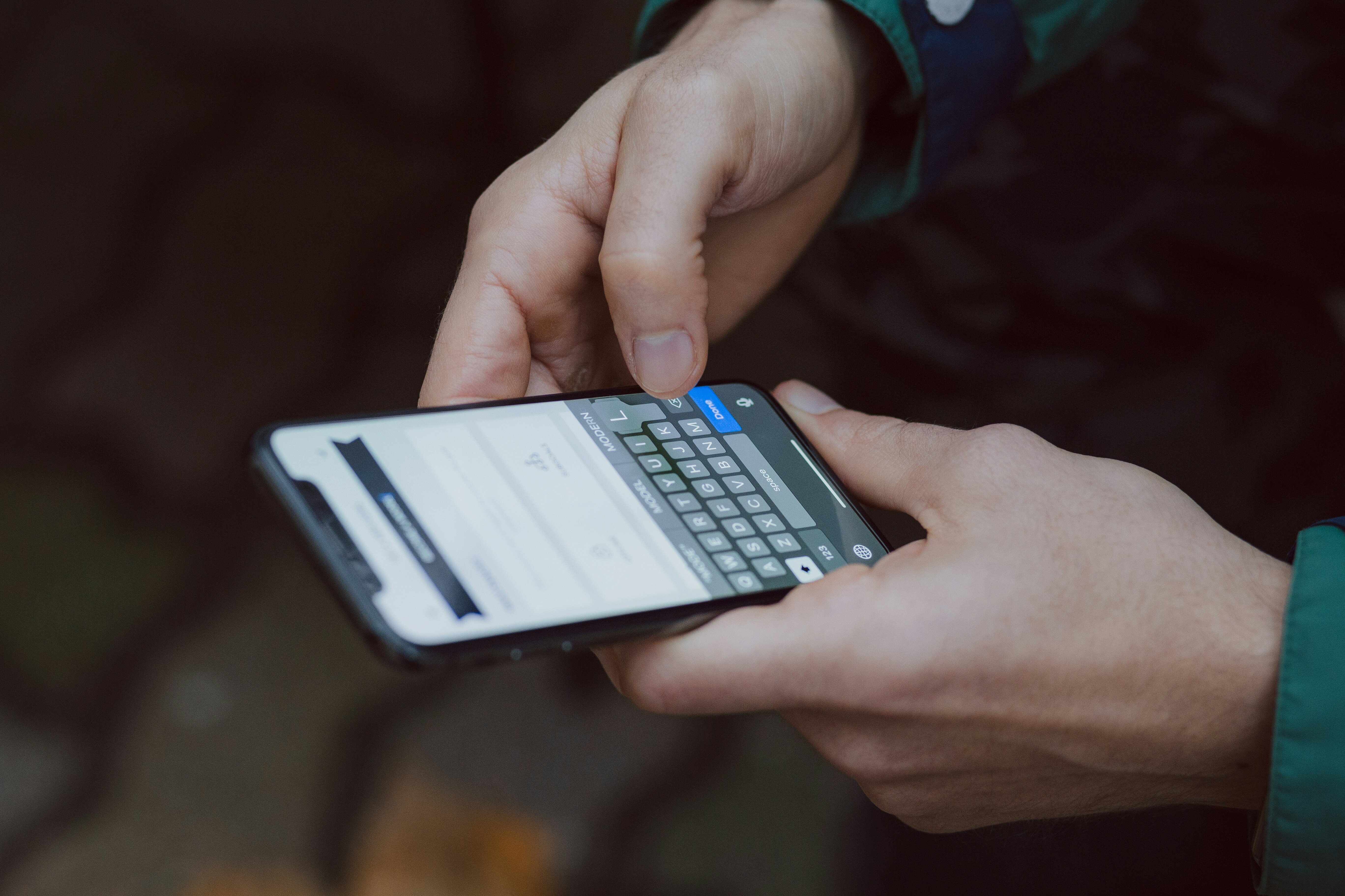 Overhead view of someone typing on an Android phone